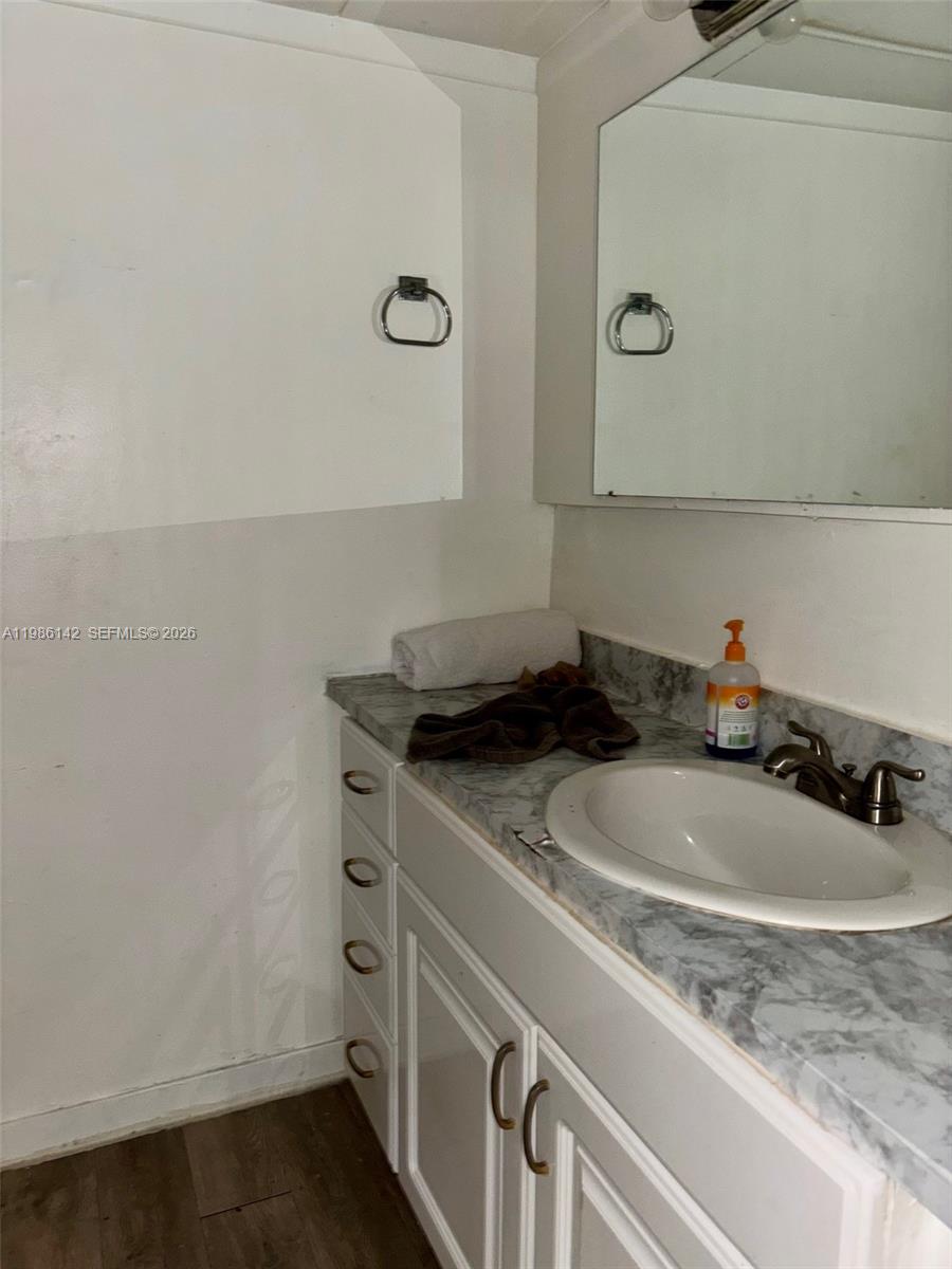 3241 Arthur Terrace Hollywood, FL 33021 - Photo 18 of 22 a bathroom with a sink and a mirror