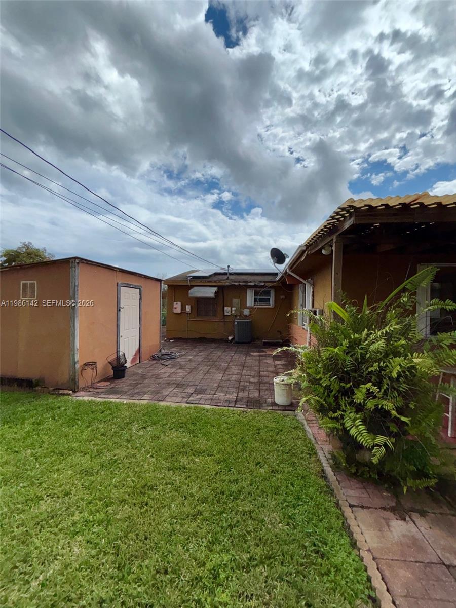 3241 Arthur Terrace Hollywood, FL 33021 - Photo 22 of 22 a backyard of a house with lots of green space
