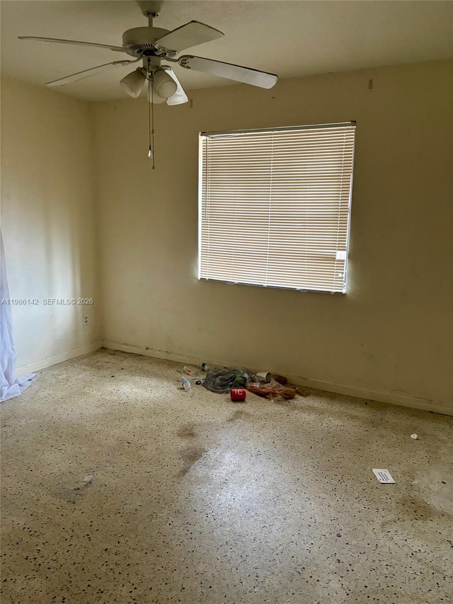 3241 Arthur Terrace Hollywood, FL 33021 - Photo 10 of 22 an empty room with a window and a fan