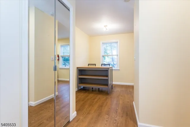 a room with a bed and a dresser