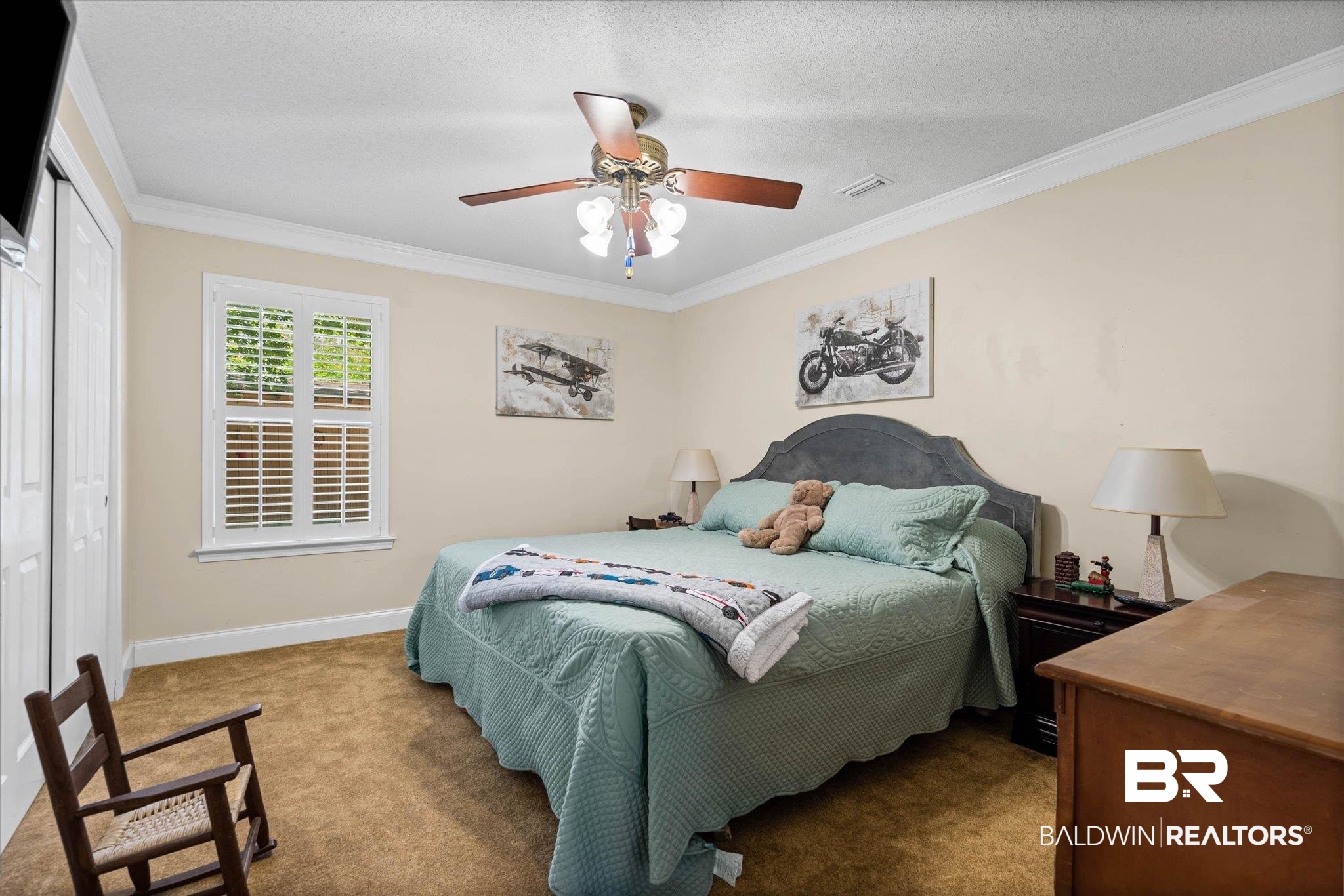 7410 Smithfield Road East Mobile, AL 36695 - Photo 14 of 24 Carpeted bedroom with a window featuring white plantation shutters