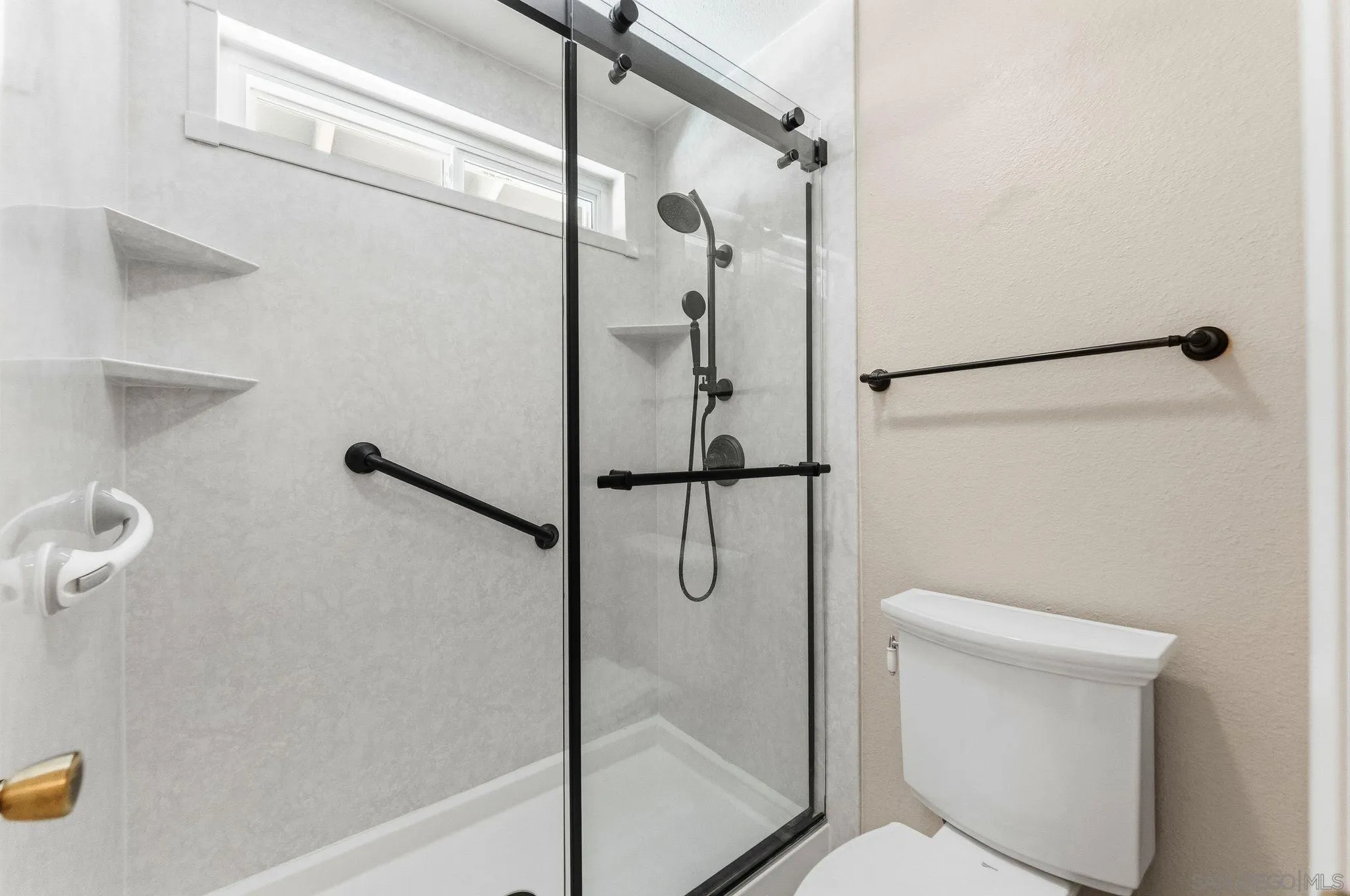 10565 Strathmore Drive Santee, CA 92071 - Photo 31 of 59 a bathroom with a shower and toilet