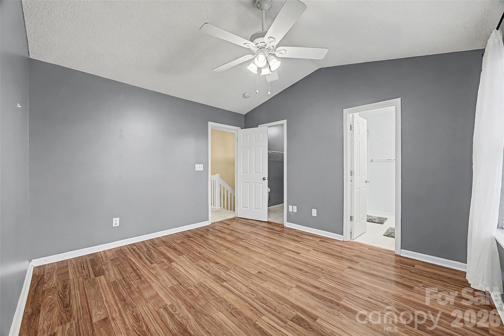 232 Butler Place Fort Mill, SC 29715 - Photo 20 of 32 a view of a room with a ceiling fan and hardwood floor