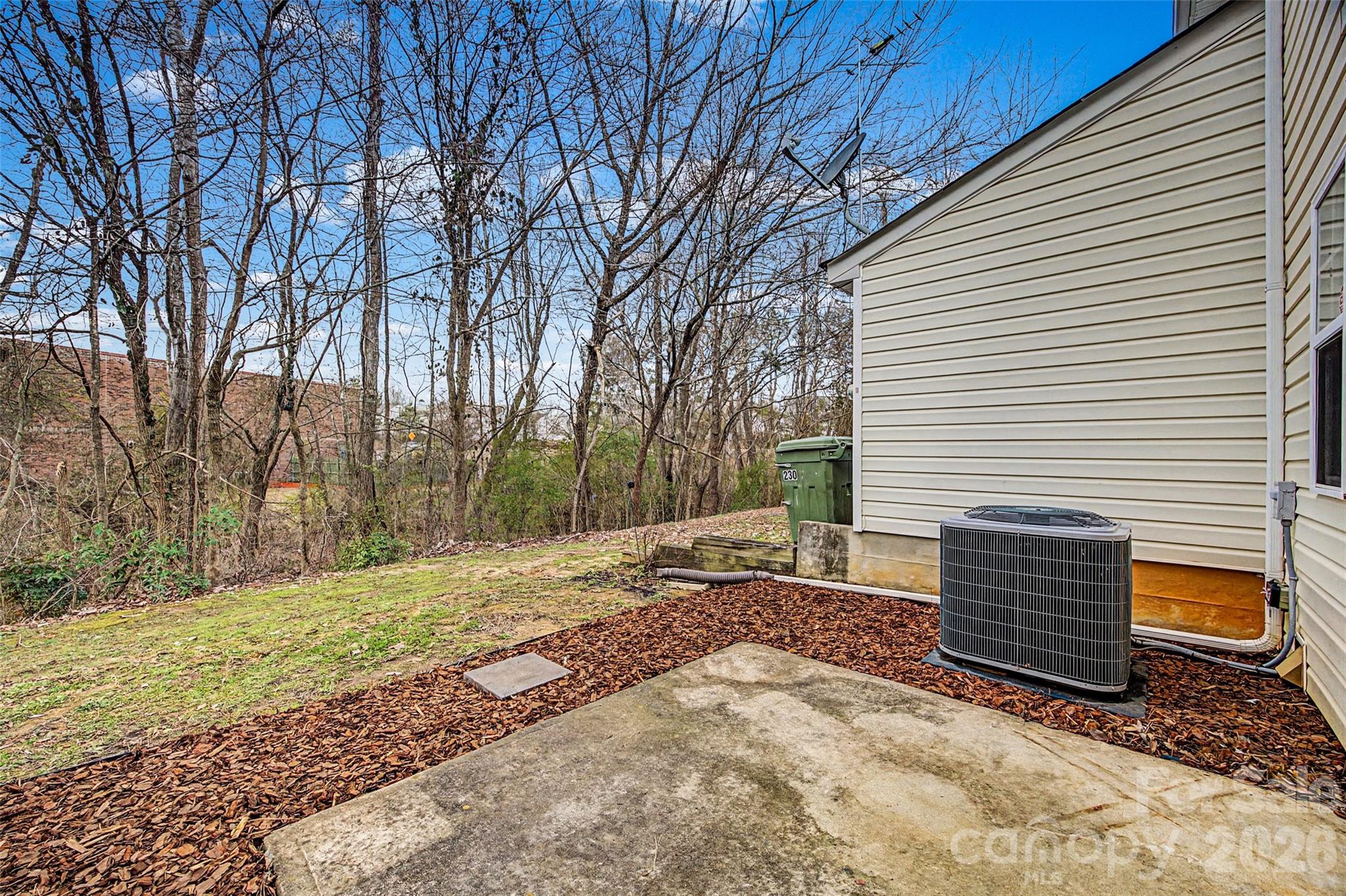 232 Butler Place Fort Mill, SC 29715 - Photo 23 of 32 a backyard of a house with large trees