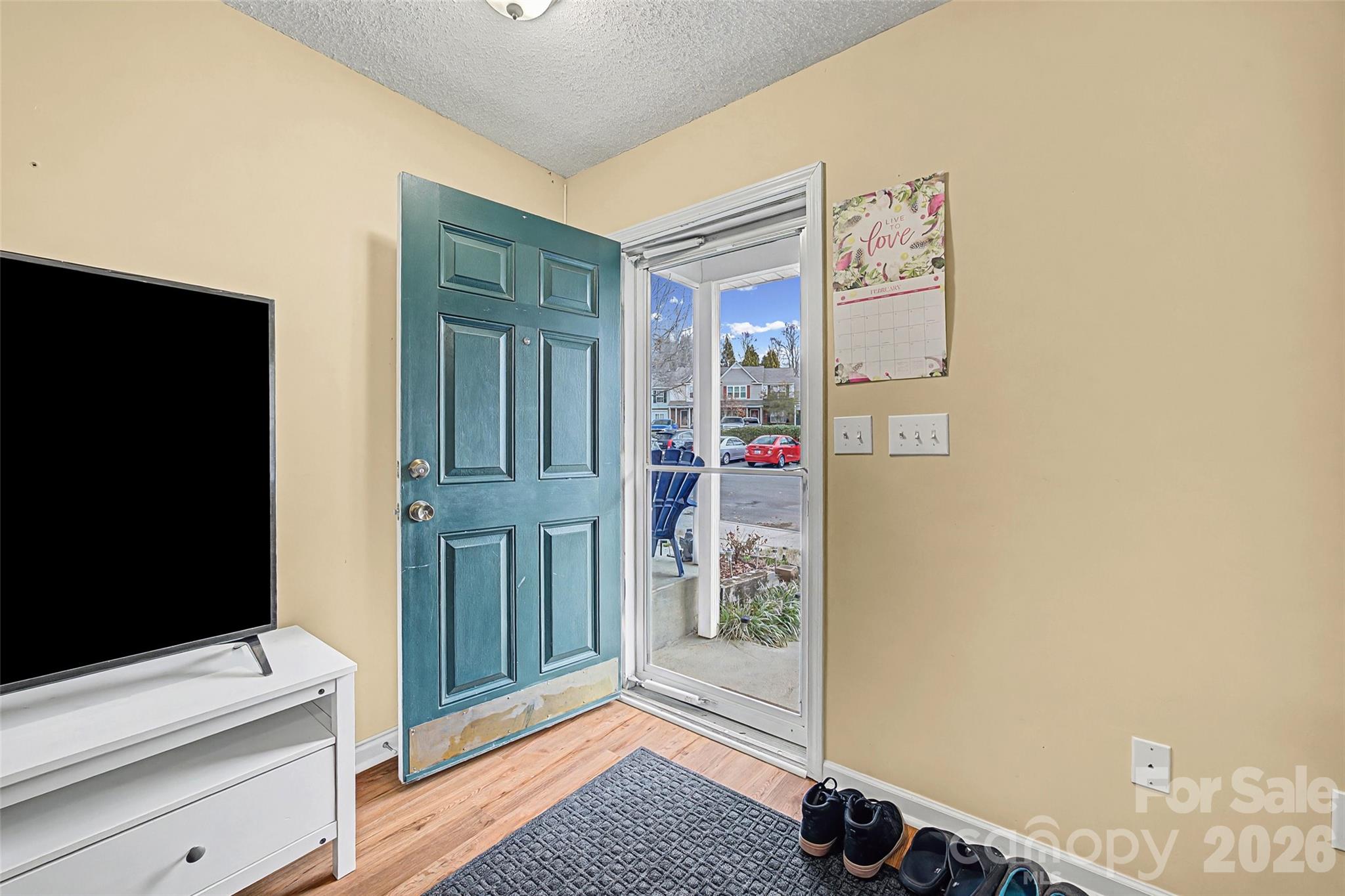 232 Butler Place Fort Mill, SC 29715 - Photo 3 of 32 a view of livingroom with hardwood floor and cabinet