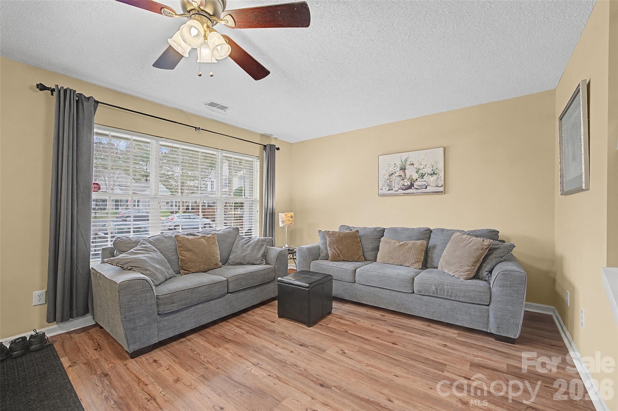 232 Butler Place Fort Mill, SC 29715 - Photo 4 of 32 a living room with furniture and a large window