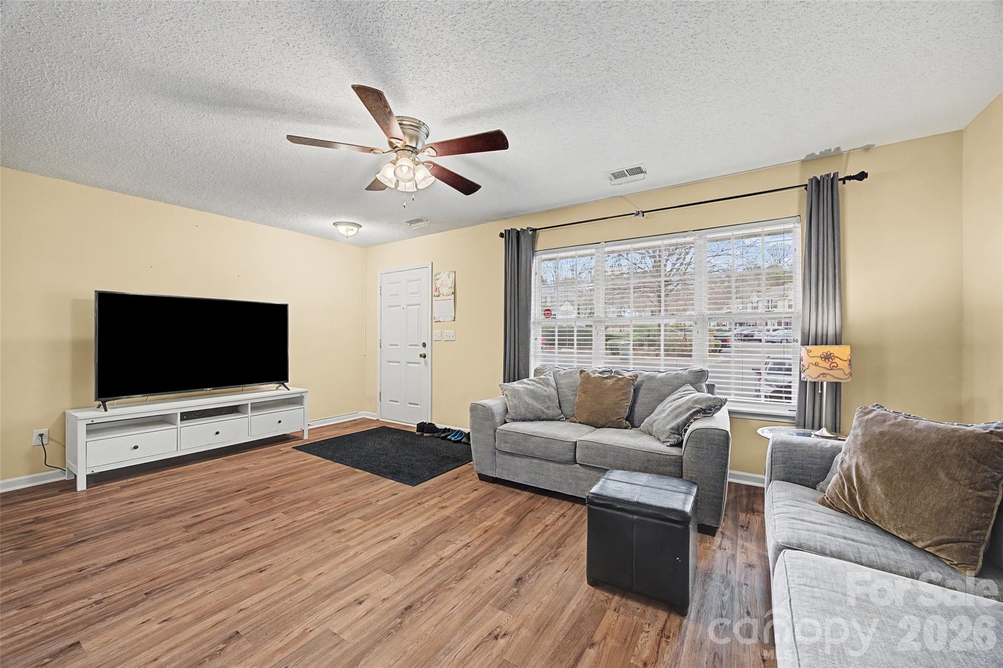 232 Butler Place Fort Mill, SC 29715 - Photo 5 of 32 a living room with furniture and a flat screen tv