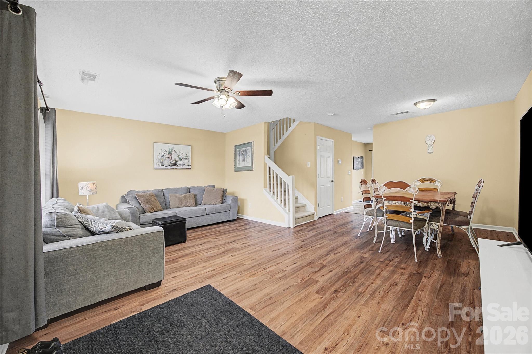 232 Butler Place Fort Mill, SC 29715 - Photo 6 of 32 a living room with furniture and wooden floor