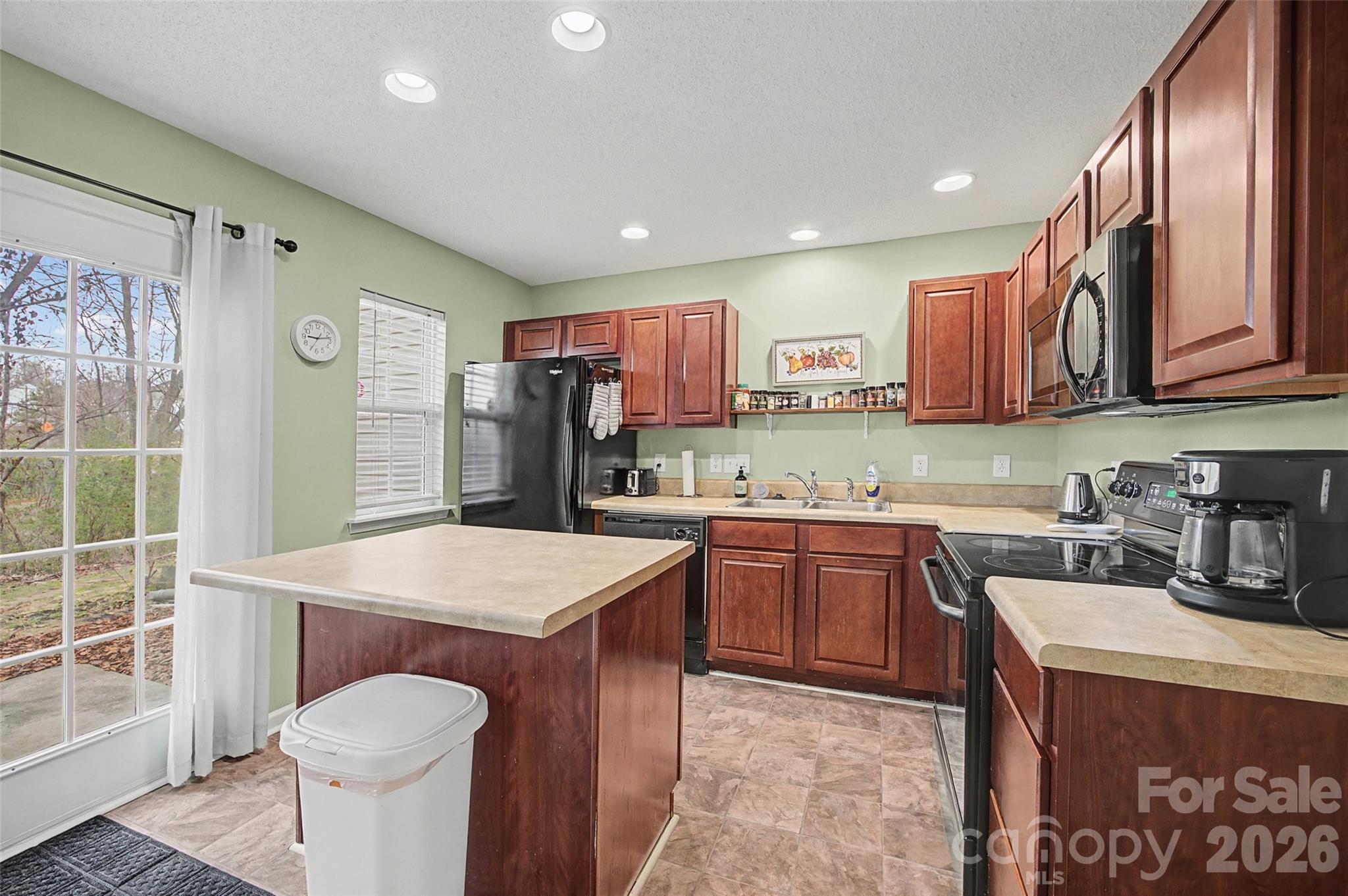 232 Butler Place Fort Mill, SC 29715 - Photo 9 of 32 a kitchen with a sink stove and refrigerator