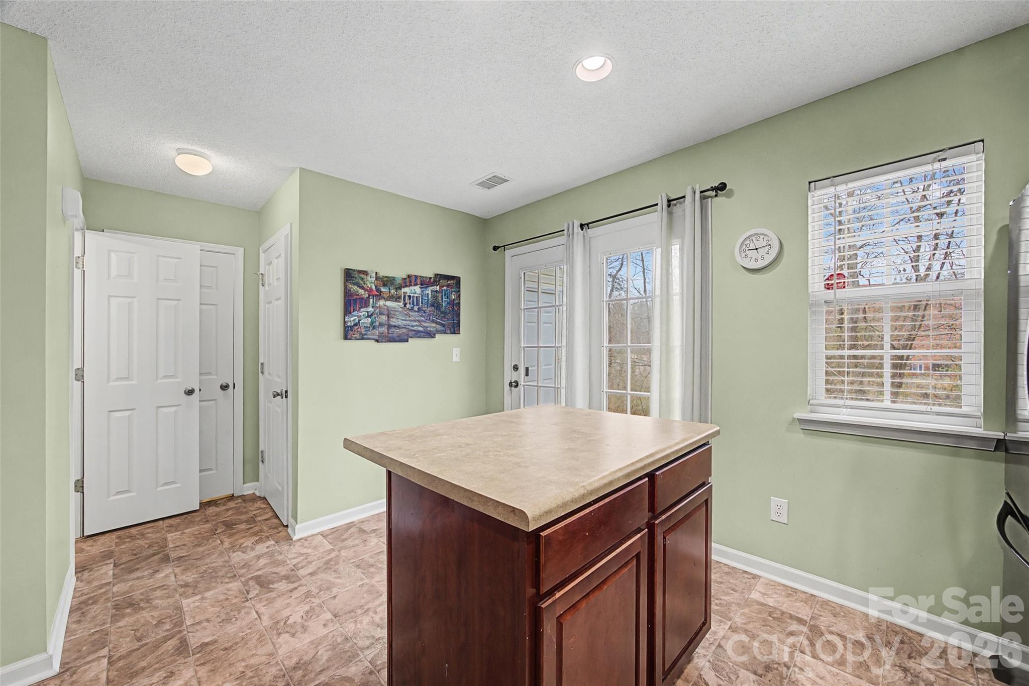 232 Butler Place Fort Mill, SC 29715 - Photo 10 of 32 a view of kitchen with granite countertop cabinets and wooden floor