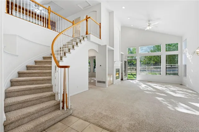 a view of a city with lush green forest