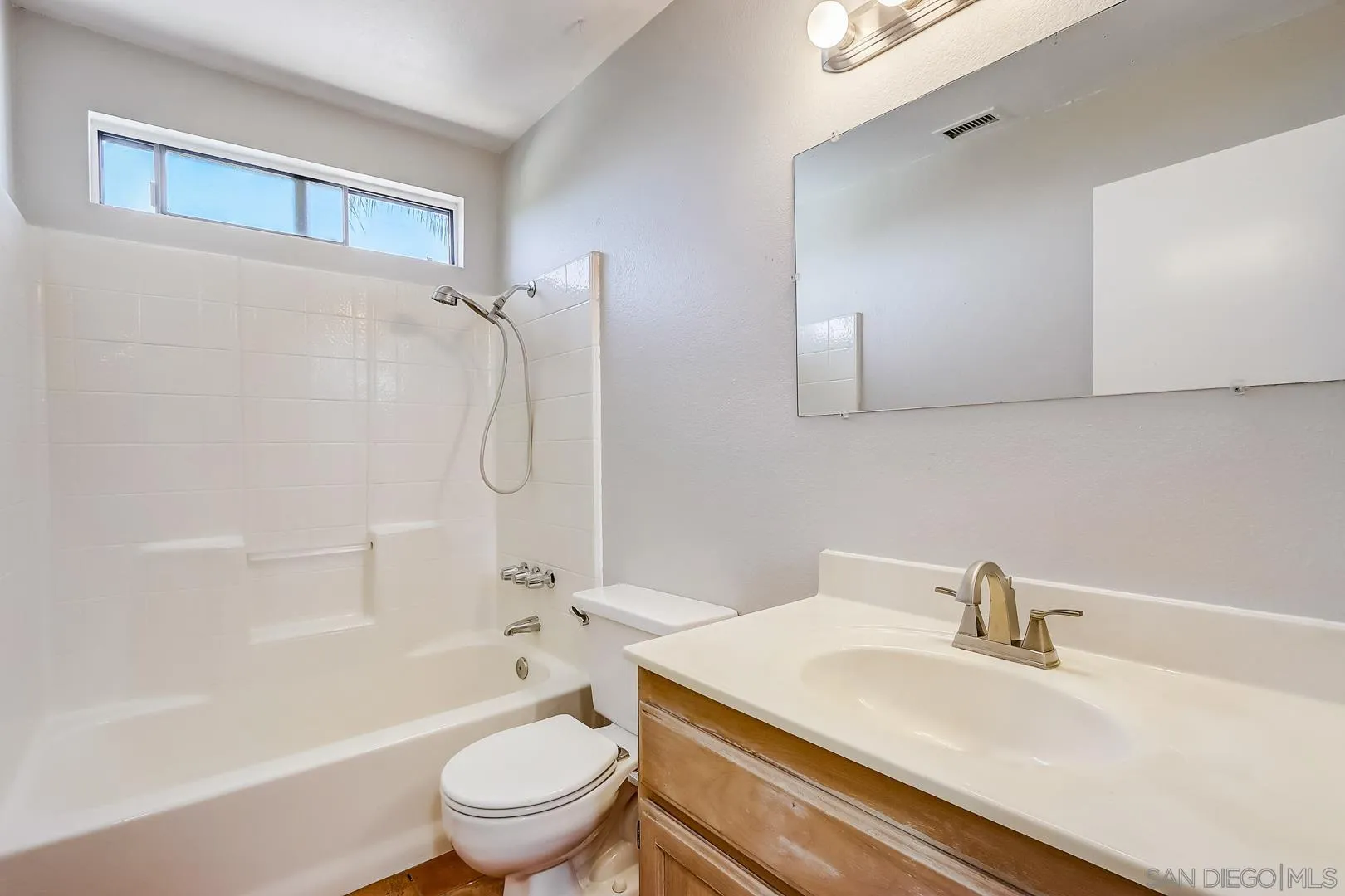 11988 Mountainview Heights Lakeside, CA 92040 - Photo 13 of 26 a bathroom with a sink a toilet and a bathtub