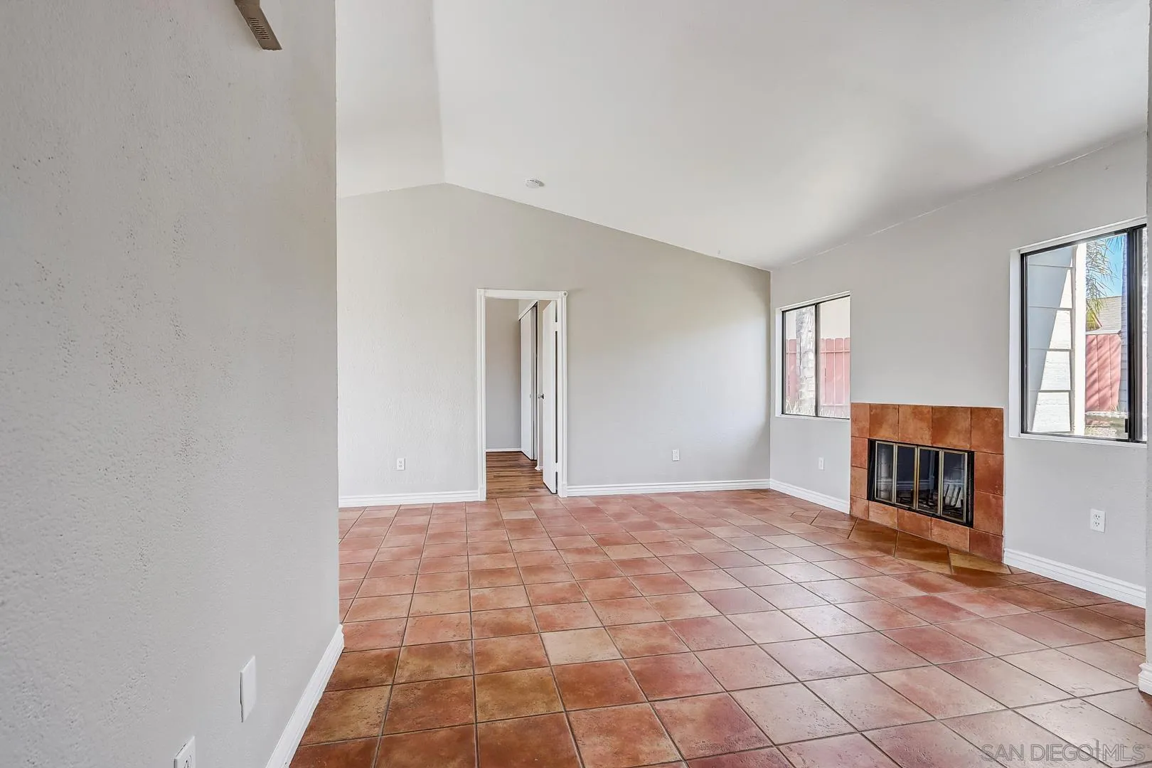 11988 Mountainview Heights Lakeside, CA 92040 - Photo 16 of 26 a view of an empty room with window and fire place