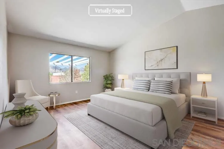 11988 Mountainview Heights Lakeside, CA 92040 - Photo 3 of 26 a bedroom with a bed plant and window