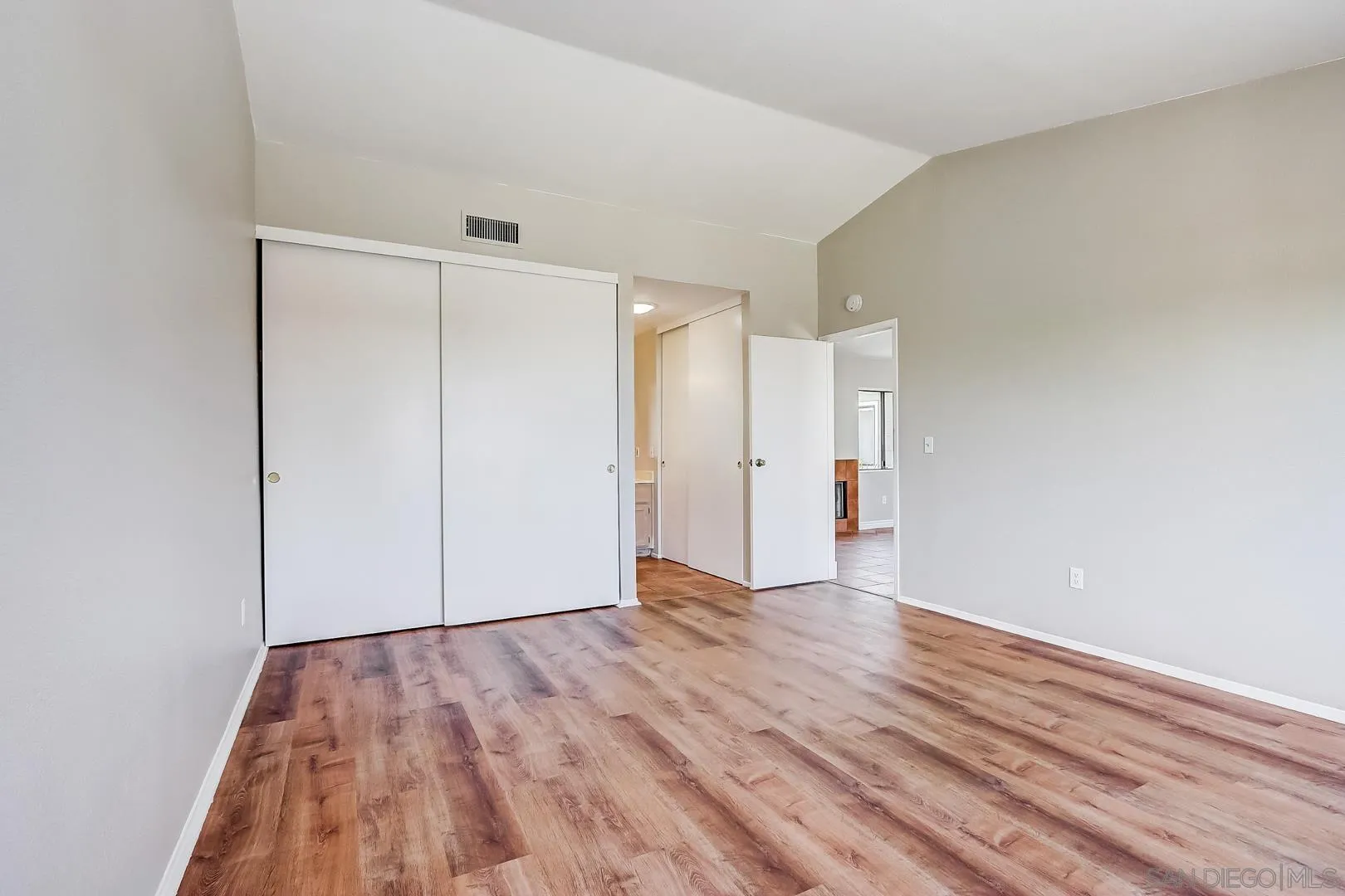 11988 Mountainview Heights Lakeside, CA 92040 - Photo 7 of 26 a view of an empty room with wooden floor