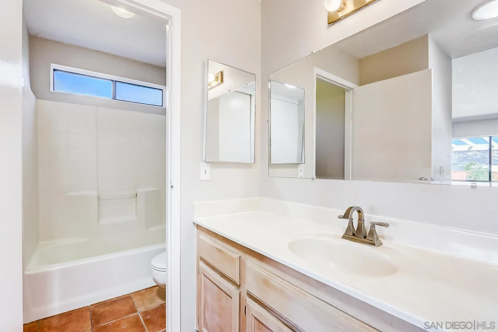 11988 Mountainview Heights Lakeside, CA 92040 - Photo 8 of 26 a bathroom with a bathtub and a sink