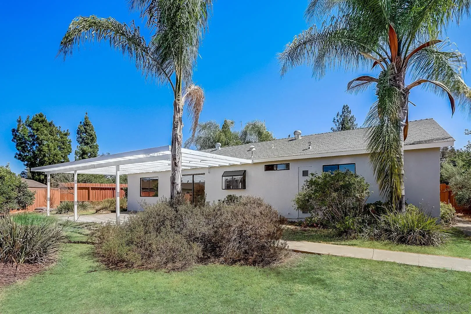11988 Mountainview Heights Lakeside, CA 92040 - Photo 9 of 26 a front view of a house with a garden