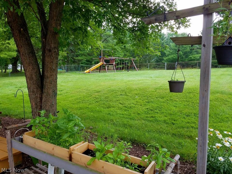10263 Auburn Road Chardon, OH 44024 - Photo 30 of 32 Lush backyard - half fully fenced - other half available for anything you want to do!