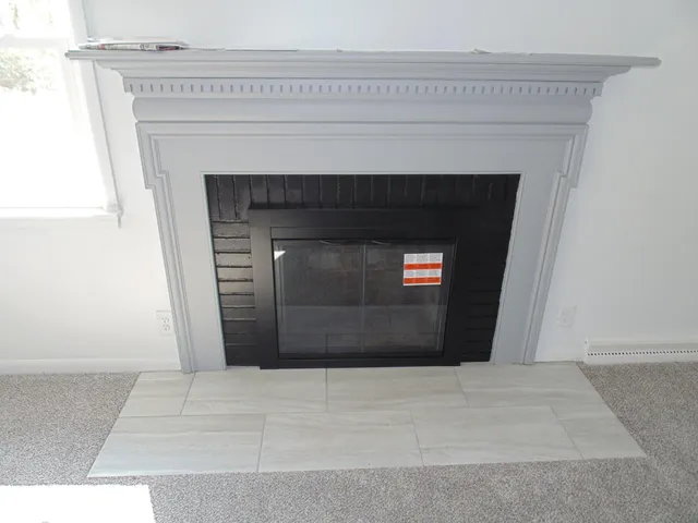 a living room with a fireplace