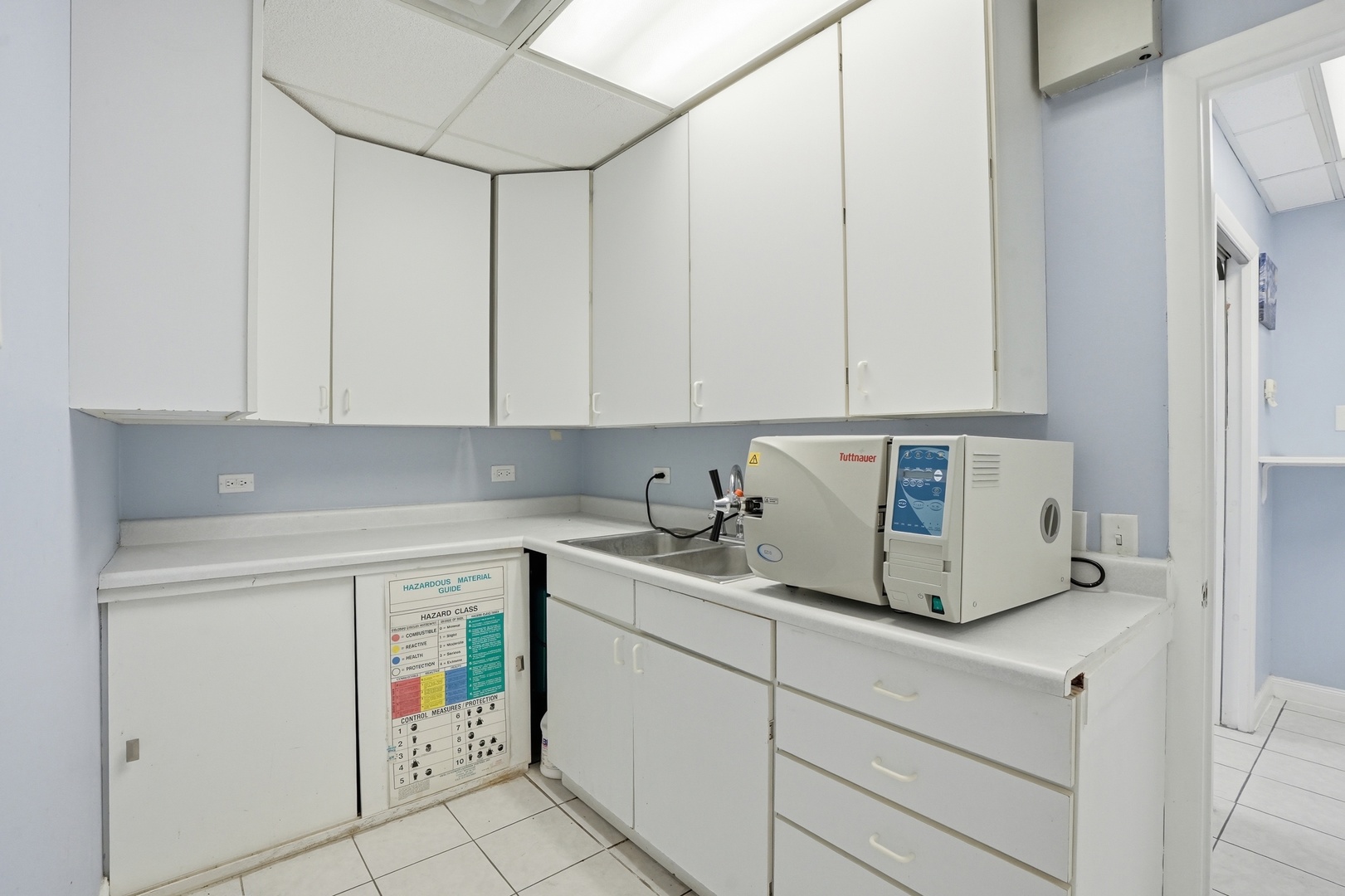2071 Irving Park Road Hanover Park, IL 60133 - Photo 25 of 53 a view of cabinets and window