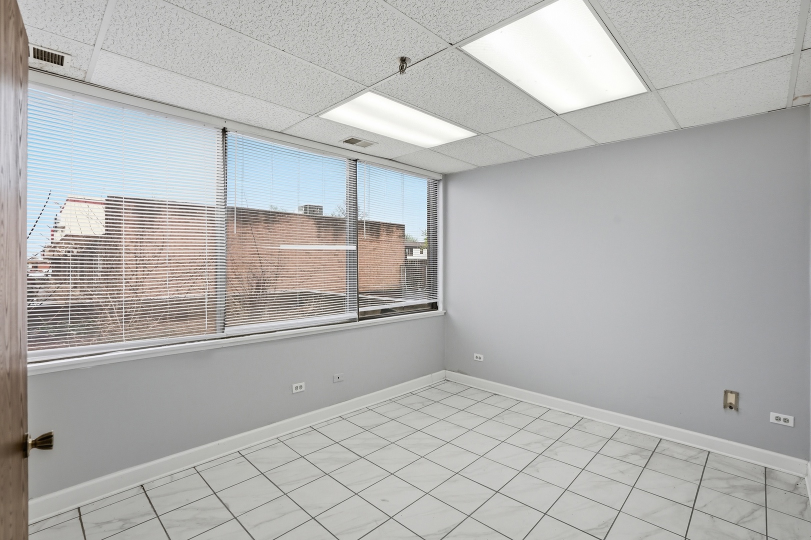 2071 Irving Park Road Hanover Park, IL 60133 - Photo 27 of 53 a view of an empty room with a window