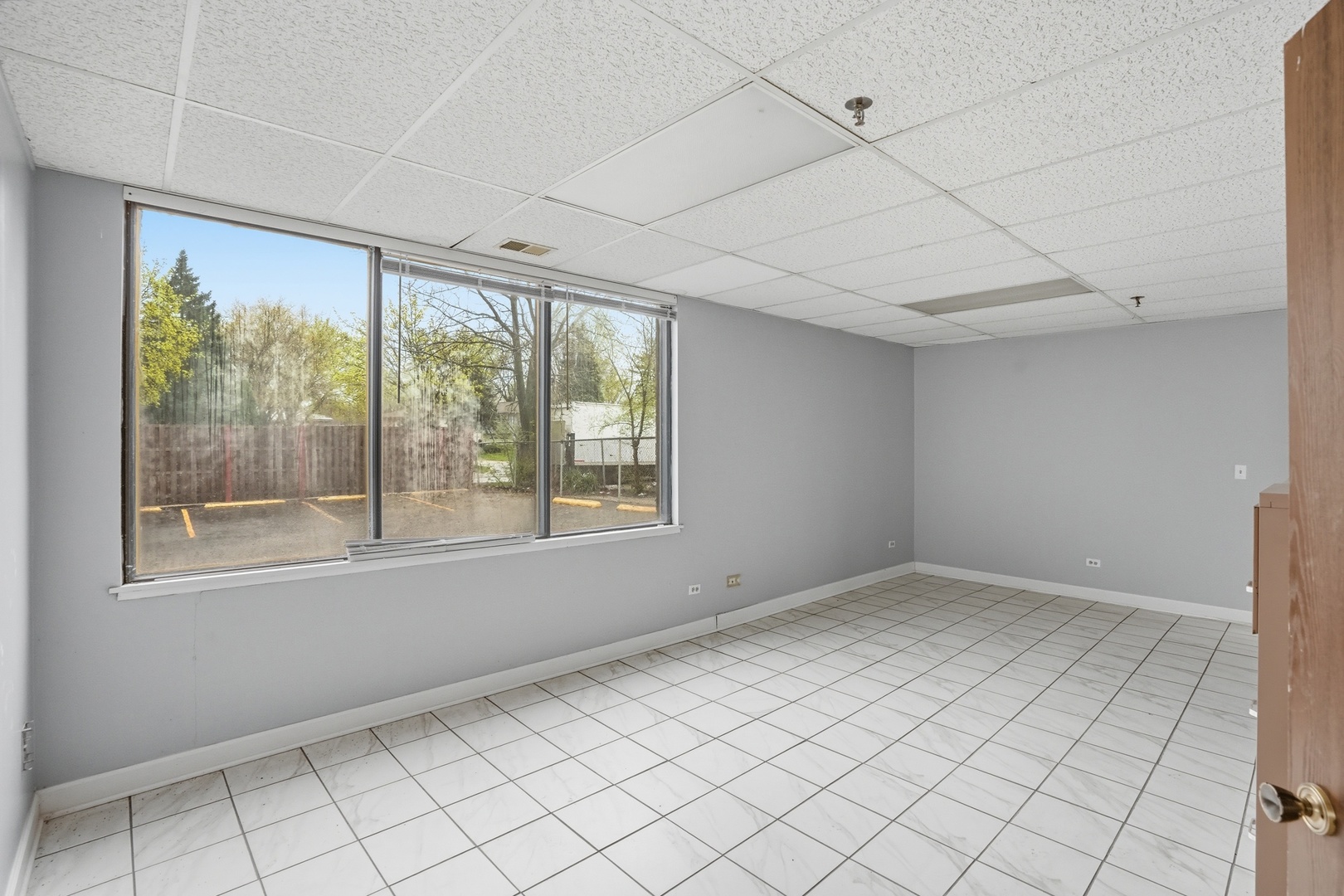 2071 Irving Park Road Hanover Park, IL 60133 - Photo 28 of 53 a view of an empty room with a window