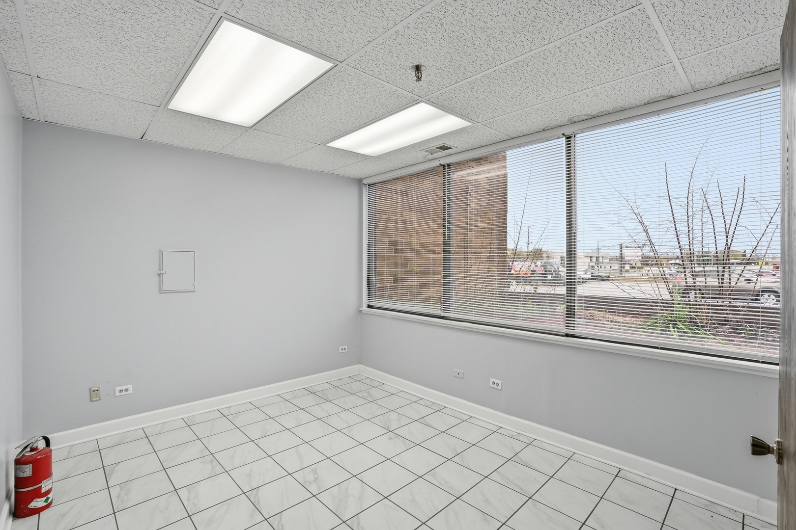 2071 Irving Park Road Hanover Park, IL 60133 - Photo 29 of 53 a view of an empty room with a window