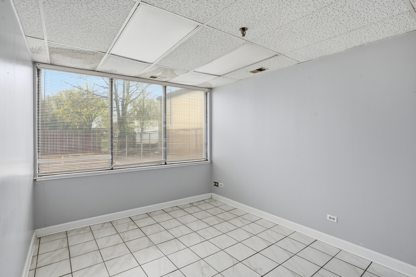2071 Irving Park Road Hanover Park, IL 60133 - Photo 31 of 53 a view of an empty room with a window