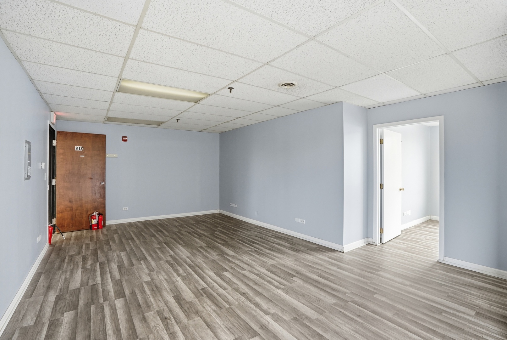 2071 Irving Park Road Hanover Park, IL 60133 - Photo 33 of 53 a view of an empty room with wooden floor