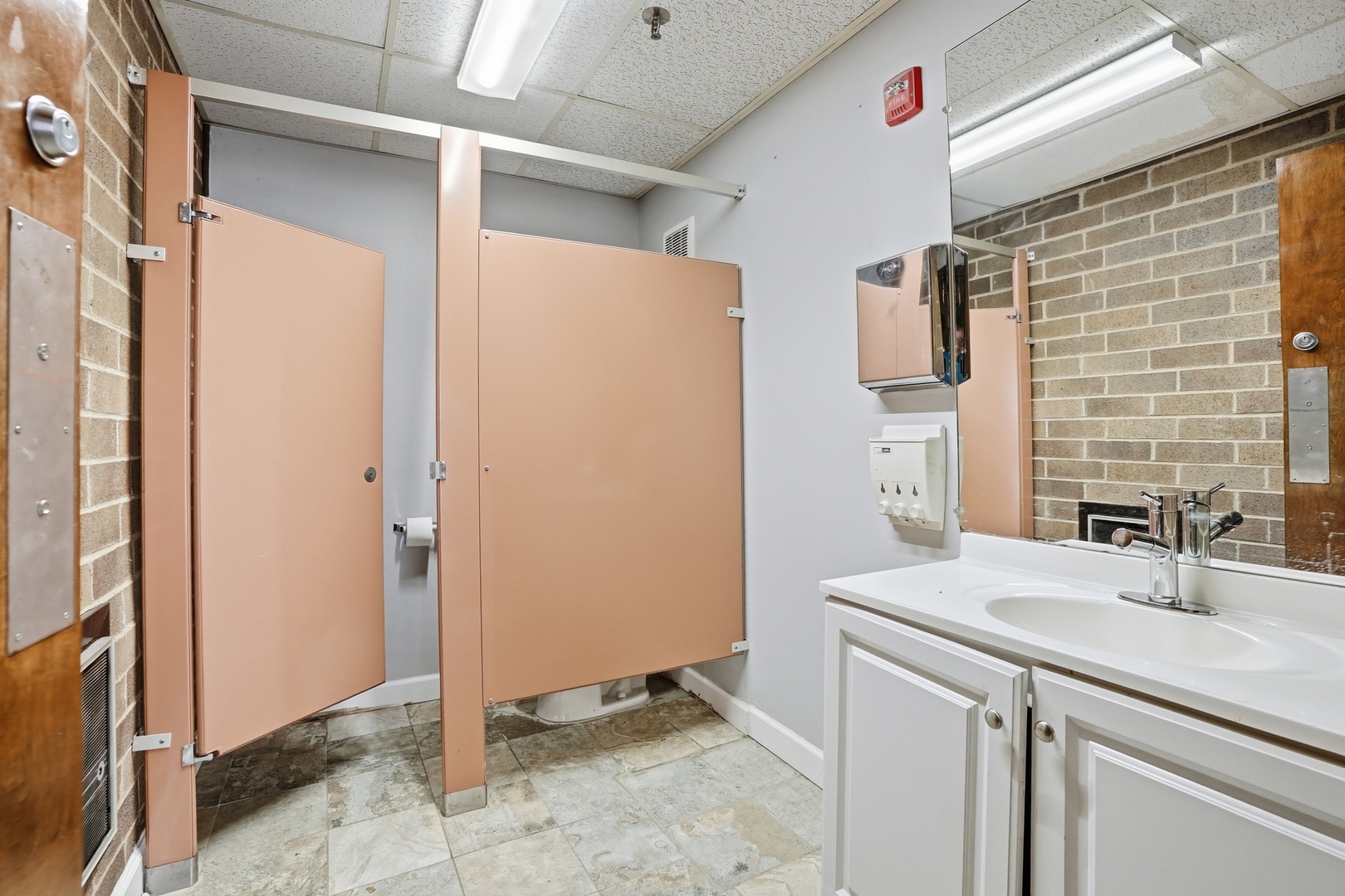 2071 Irving Park Road Hanover Park, IL 60133 - Photo 35 of 53 a bathroom with a sink and a mirror