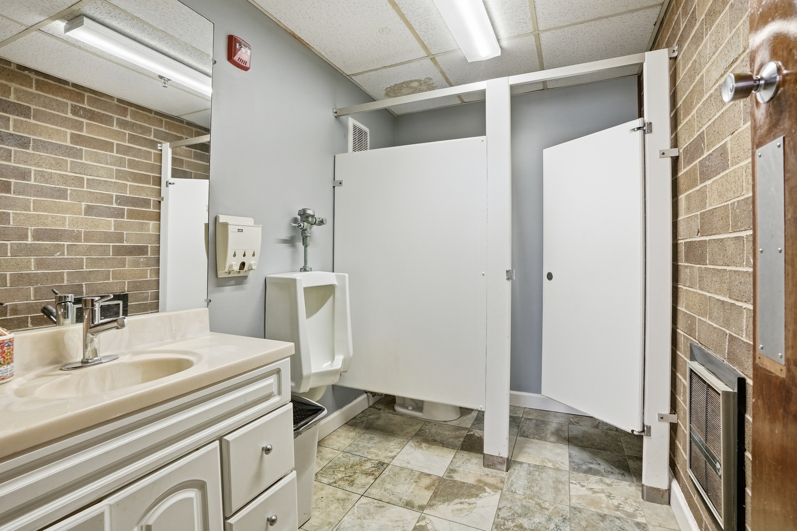 2071 Irving Park Road Hanover Park, IL 60133 - Photo 38 of 53 a bathroom with a sink and a mirror