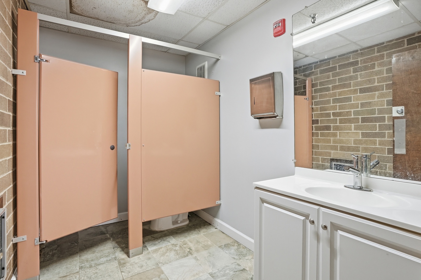 2071 Irving Park Road Hanover Park, IL 60133 - Photo 42 of 53 a bathroom with a sink and a mirror