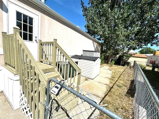a view of balcony with wooden floor and seating space