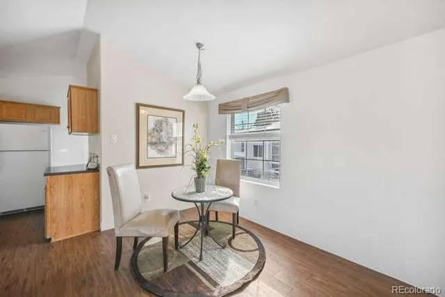 a view of a livingroom with furniture and wooden floor