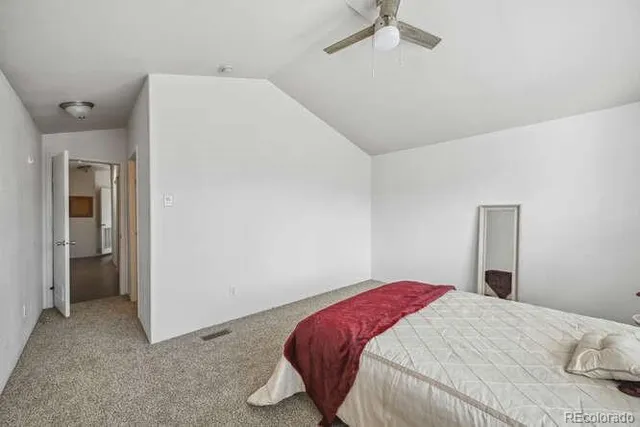 a bedroom with a bed and a cabinets