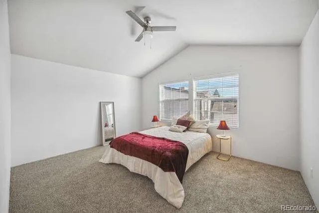 a bed room with a bed and a window