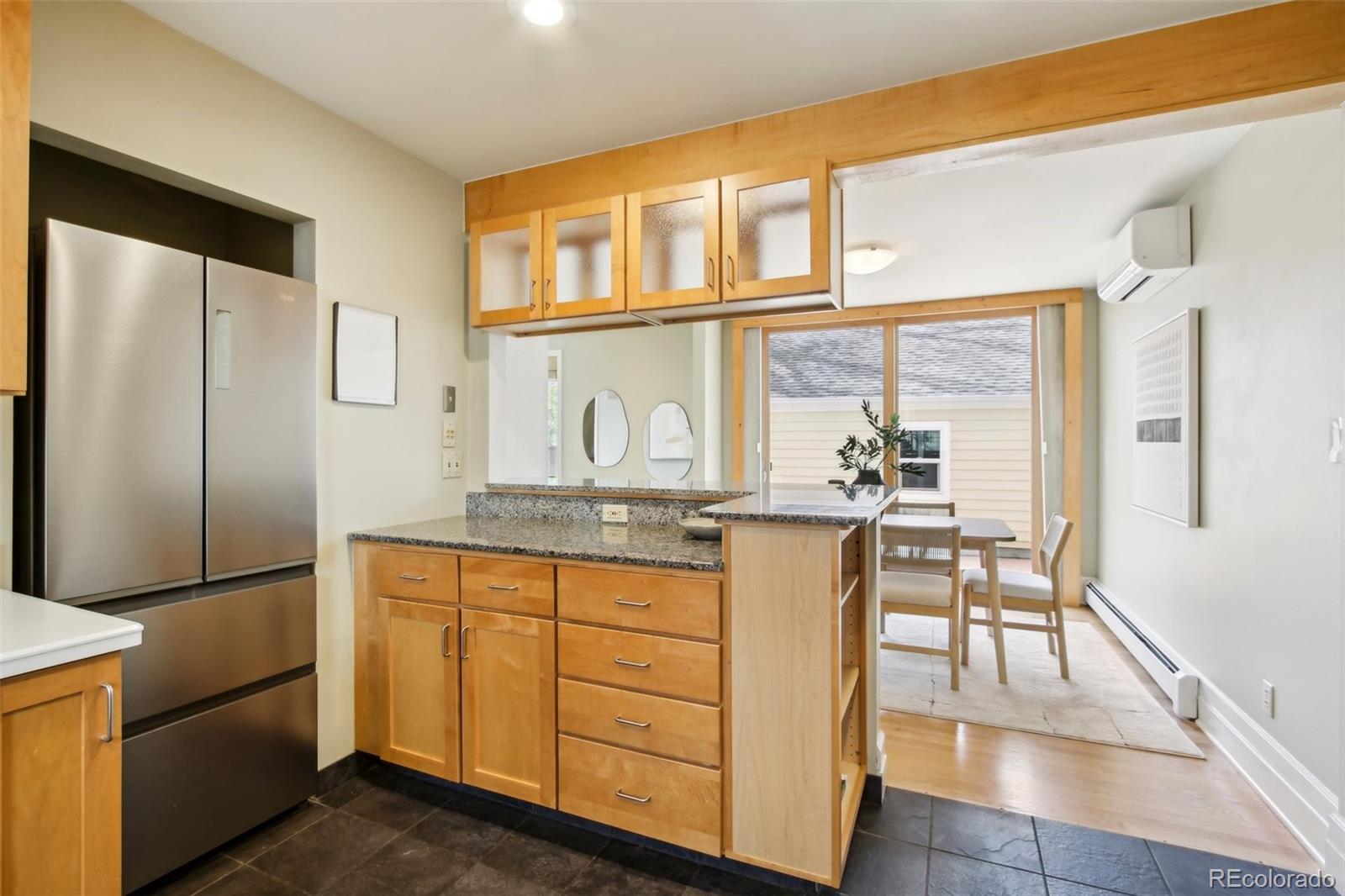 2255 18th Street Boulder, CO 80302 - Photo 11 of 45 a kitchen with stainless steel appliances granite countertop a refrigerator and a stove