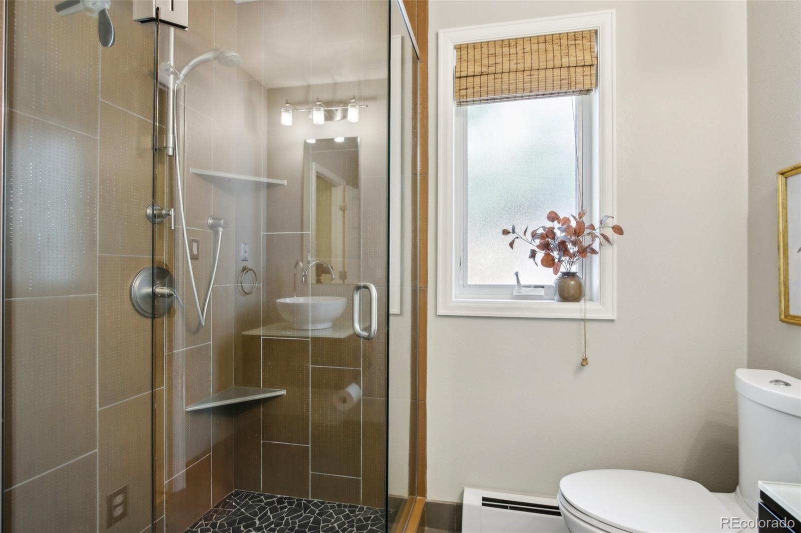 2255 18th Street Boulder, CO 80302 - Photo 14 of 45 a bathroom with a toilet and a shower