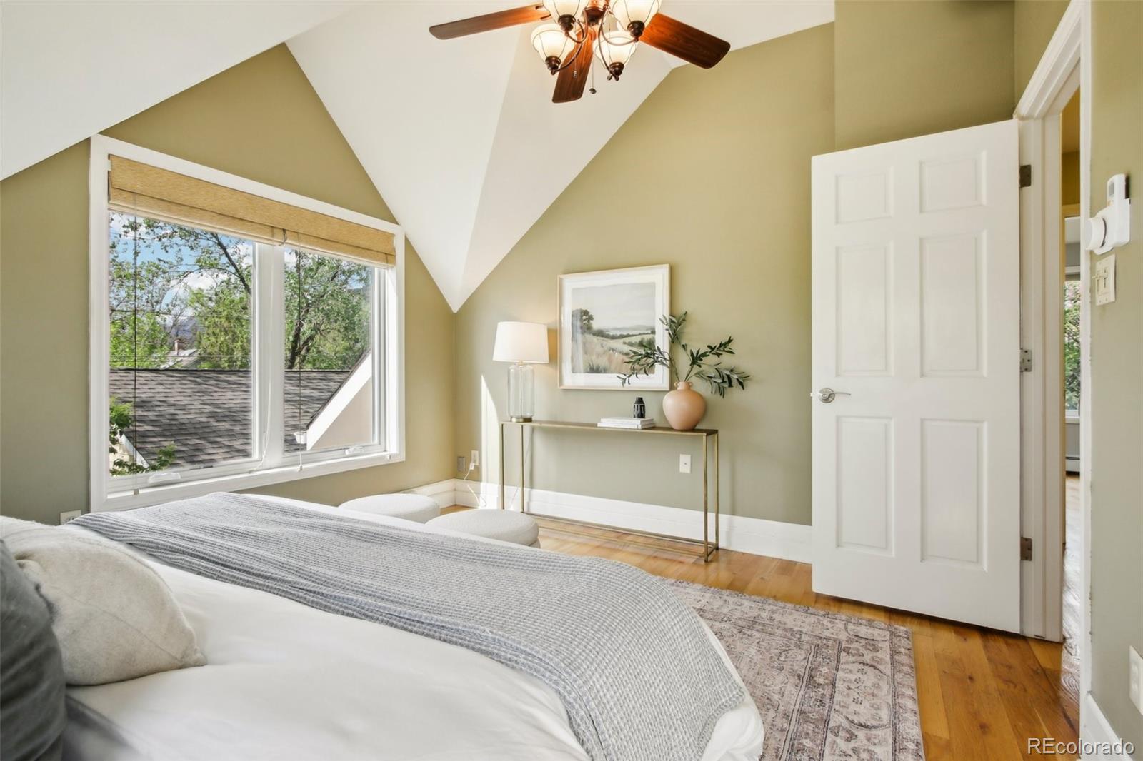 2255 18th Street Boulder, CO 80302 - Photo 17 of 45 a bedroom with a bed and a large window