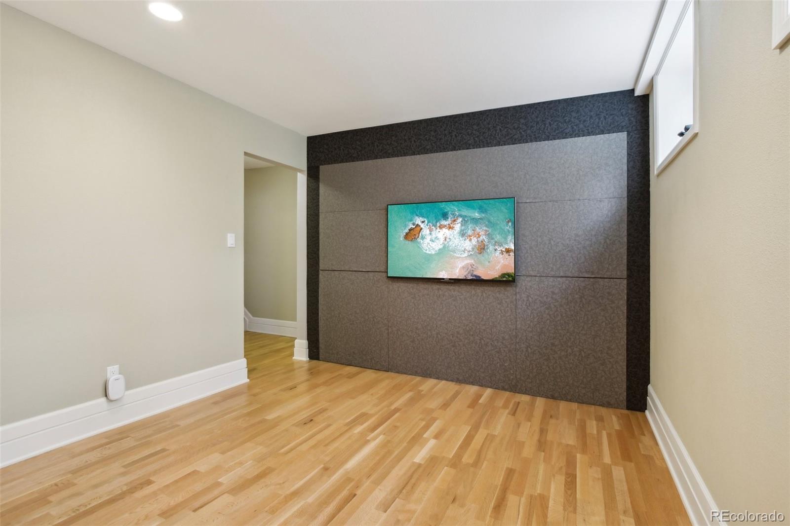 2255 18th Street Boulder, CO 80302 - Photo 24 of 45 a view of a room with wooden floor and a ceiling fan