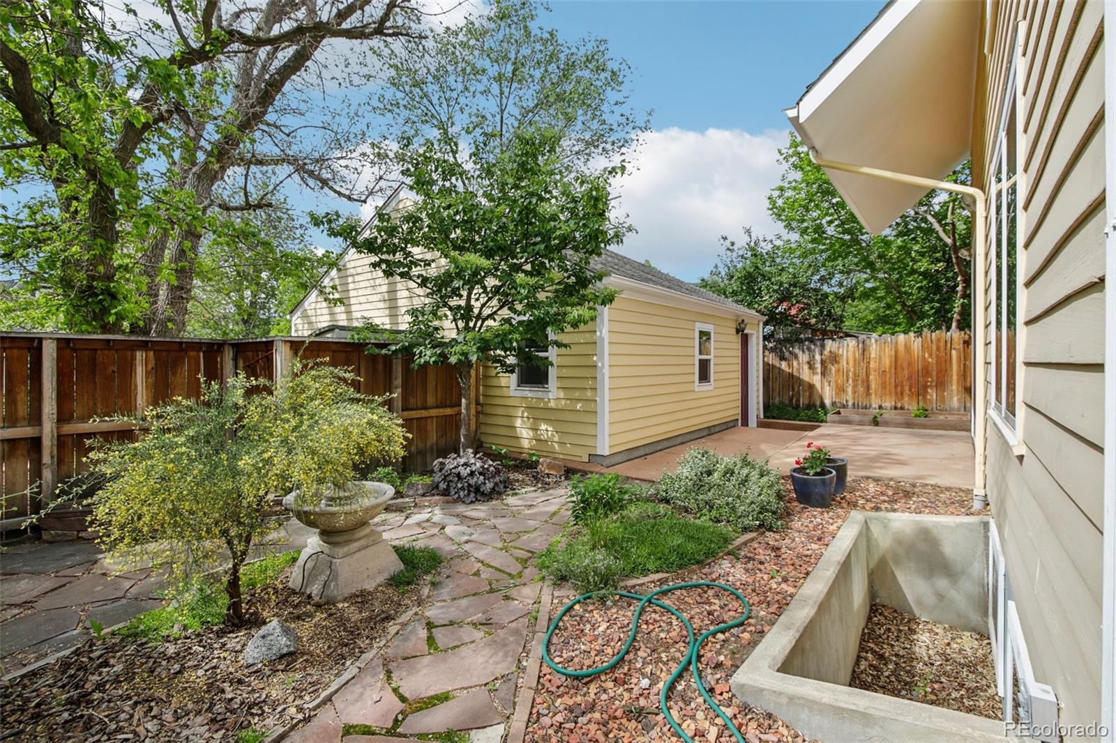 2255 18th Street Boulder, CO 80302 - Photo 31 of 45 a front view of a house with garden