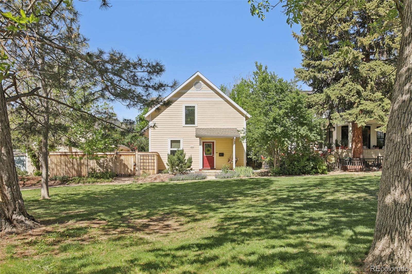 2255 18th Street Boulder, CO 80302 - Photo 39 of 45 a front view of a house with a yard