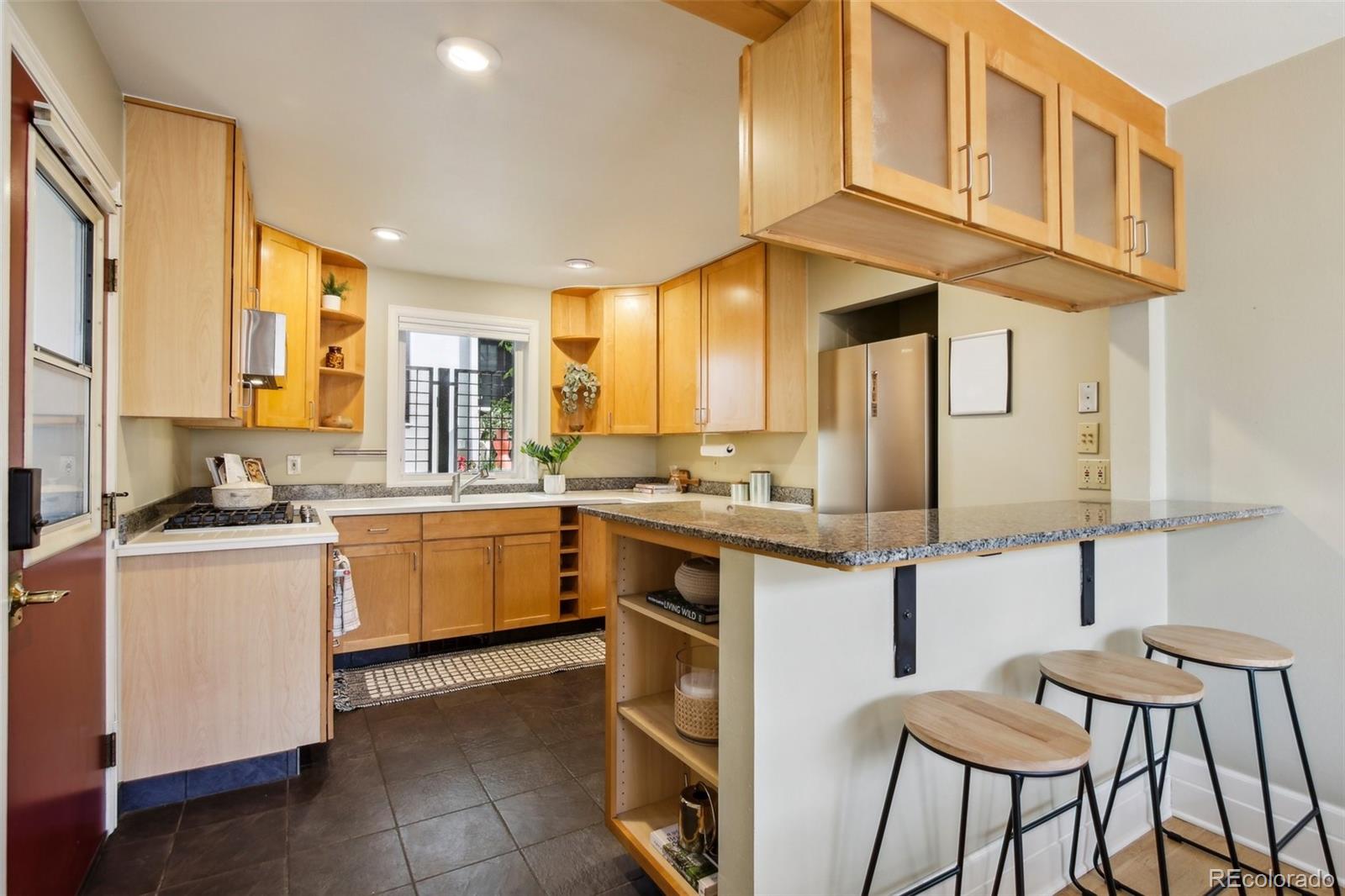 2255 18th Street Boulder, CO 80302 - Photo 9 of 45 a kitchen with a sink cabinets and window