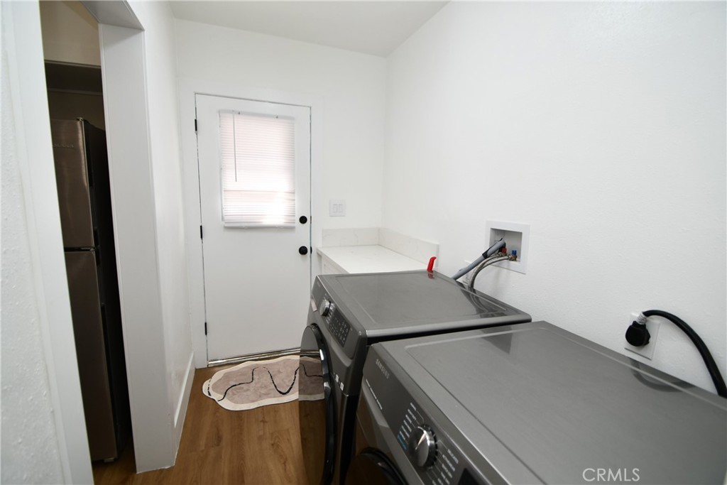 4028 160th Street Lawndale, CA 90260 - Photo 14 of 26 a bathroom with a sink and a washing machine