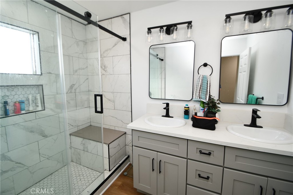 4028 160th Street Lawndale, CA 90260 - Photo 4 of 26 a bathroom with a double vanity sink mirror and double