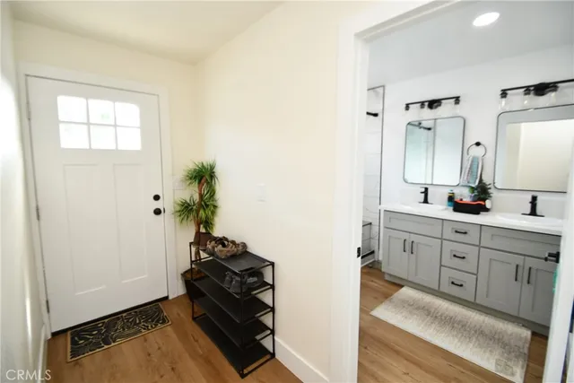 a spacious bathroom with a double vanity sink and a mirror