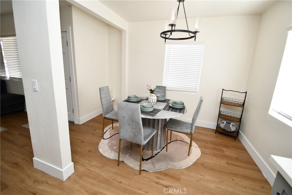 4028 160th Street Lawndale, CA 90260 - Photo 10 of 26 a dining room with furniture window and wooden floor