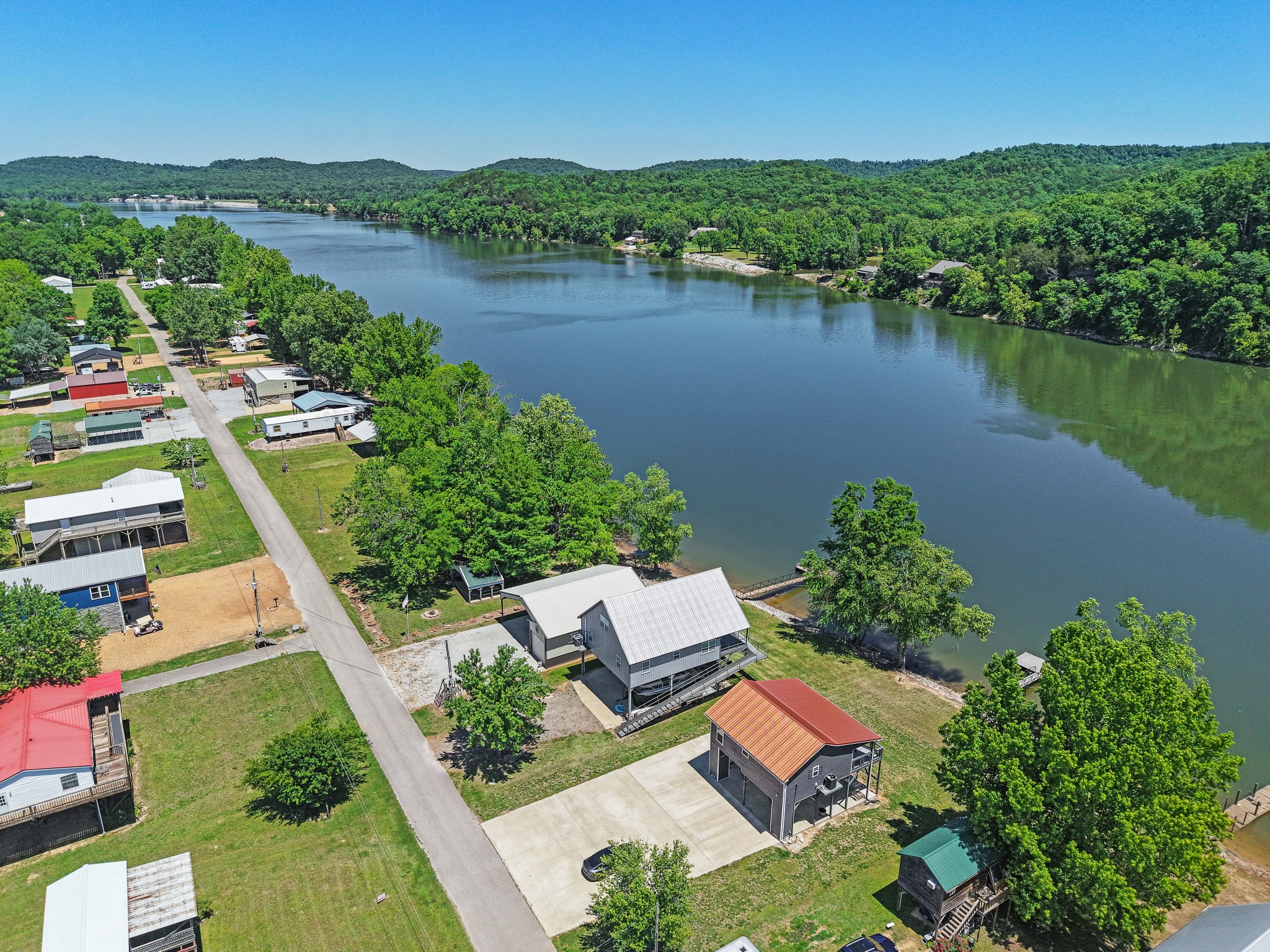 958 Pevahouse Camp Lane Decaturville, TN 38329 - Photo 24 of 32 an aerial view of house with yard and lake view