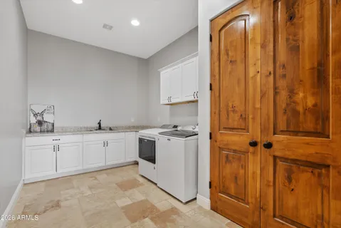 a kitchen with a sink and cabinets