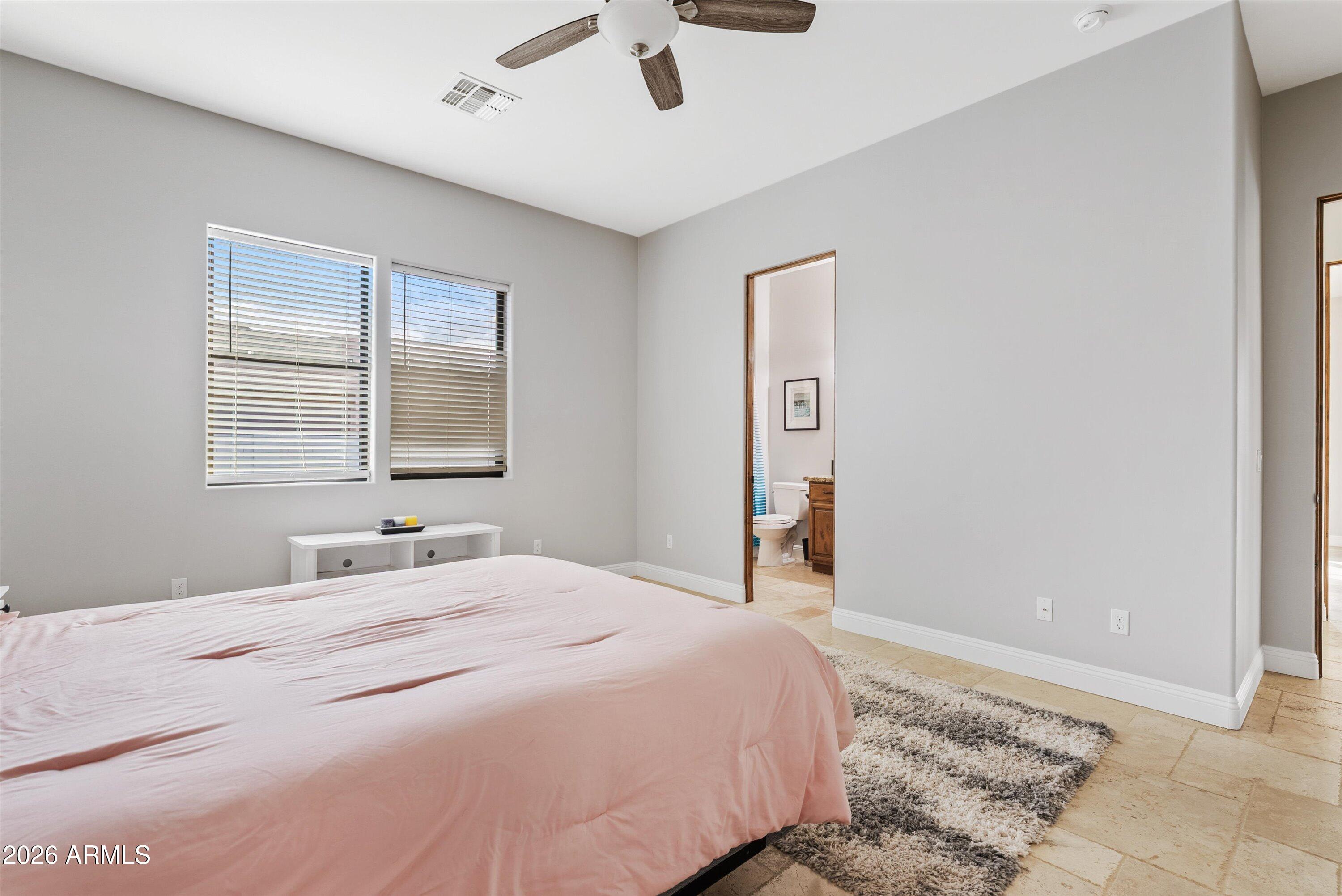 1617 West Maddock Road Phoenix, AZ 85086 - Photo 23 of 50 a bedroom with a bed and a window
